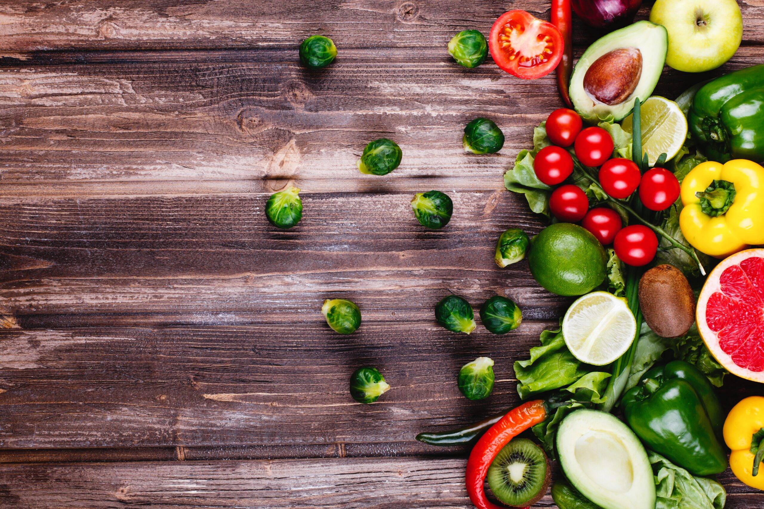 fresh healthy food avocabo brussel sprouts cucumbers red yellow green peppers scaled